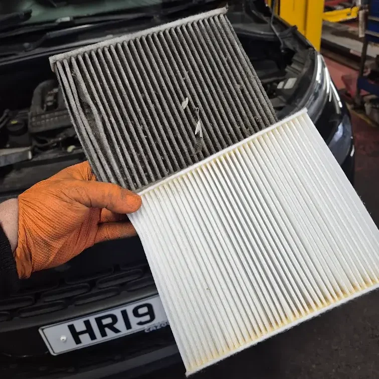 Air filter replacement next to old dirty one