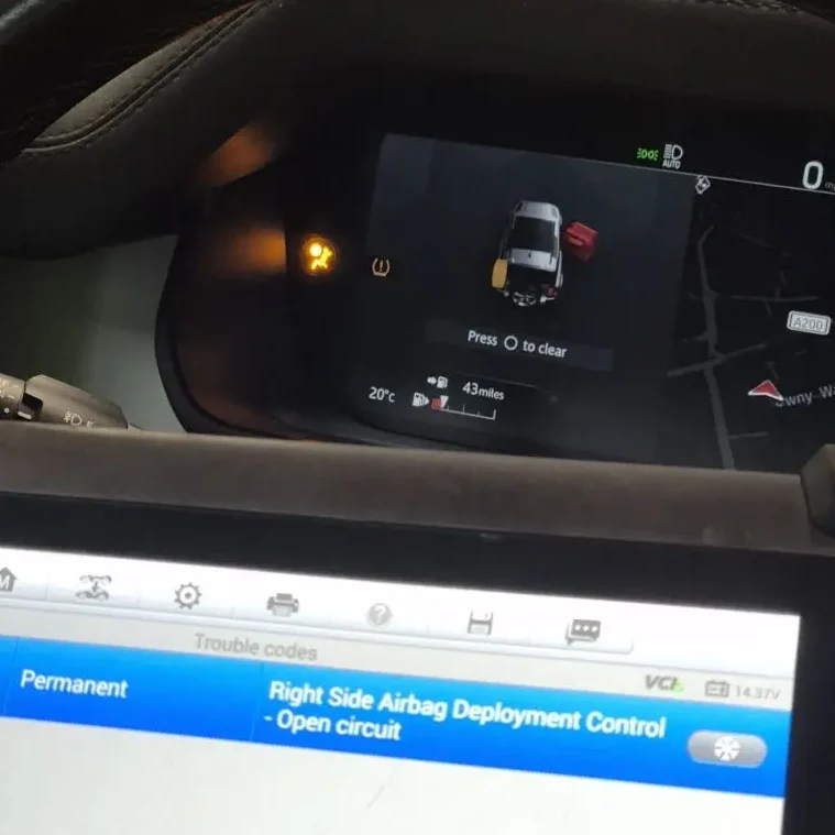 Dashboard display showing a car with warning lights and diagnostics for airbag systems.