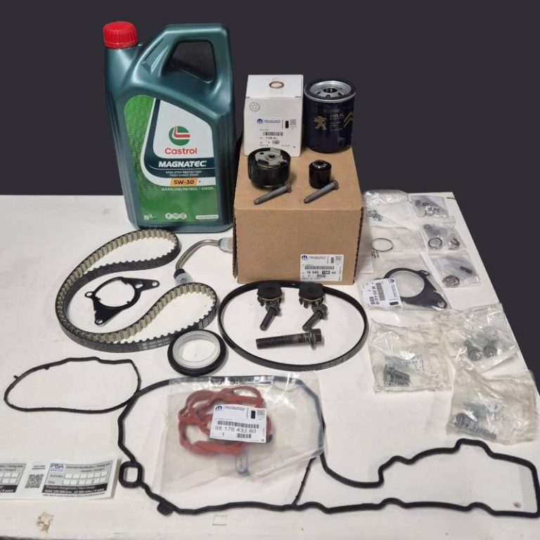 A full PureTech wet timing belt kit displayed next to 5L Castrol Magnatec 5W-30 P oil at GJ Motors workshop