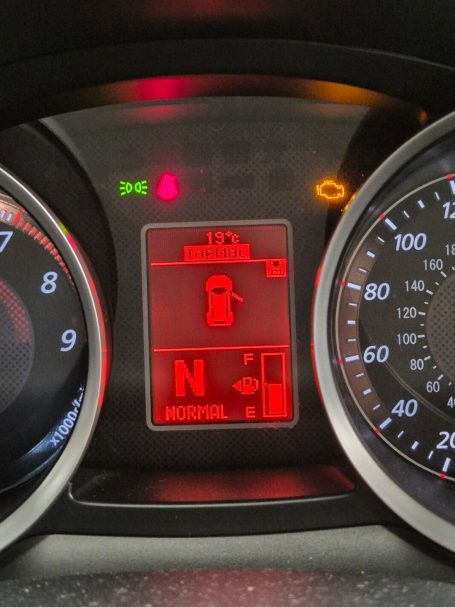 Dashboard warning lights displaying engine management light (MIL) is illuminated.